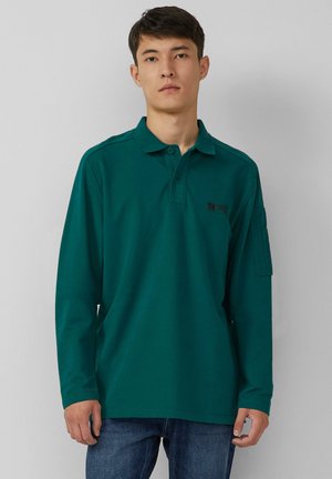 Long-sleeve polo shirt in dark green cotton, featuring a three-button collar and a small logo on the chest. Plain design with a relaxed fit.