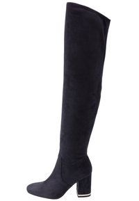 Knähöga, marinblå mockaboots med klack. Har en slank design, mjuk yta och en minimalistisk ovandel utan synlig hårdvara.