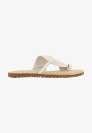 Sandalia de tela blanca con diseño entrecruzado, plantillas de gamuza suave y suela de goma texturizada. Ligera y de perfil plano.