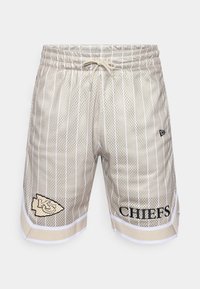 Beige mesh shorts with white vertical stripes, elastic waistband, drawstring, and black printed "CHIEFS" and logo on the left leg.