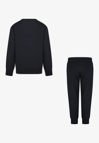 Dark navy sweatshirt with ribbed hem and cuffs; matching sweatpants with elastic waistband and tapered cuffs. Smooth cotton blend fabric.