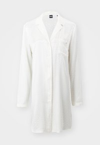 Camicia bianca a maniche lunghe con un motivo testurizzato geometrico trasparente, chiusura con bottoni, colletto e taschino sul lato sinistro del petto. Tessuto morbido e leggero.