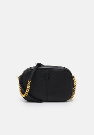 Black leather crossbody bag with a textured finish, featuring a gold chain strap and logo detail on the front. Compact and oval-shaped design.