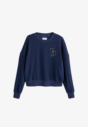 Marineblauw wafelstructuur sweatshirt met een cropped ontwerp, brede mouwen, geribbelde manchetten en een geborduurd gouden logo op de linkerkant van de borst.