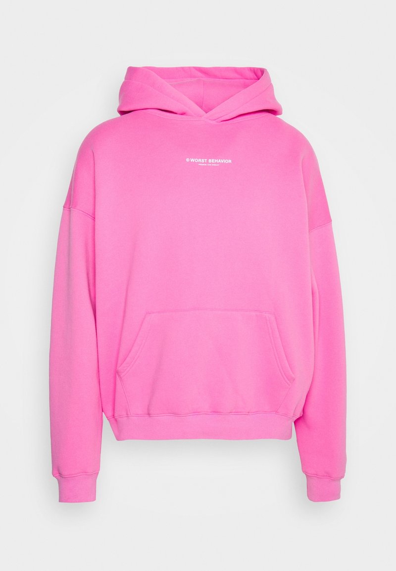 Sudadera rosa de gran tamaño hecha de tela suave, con un bolsillo frontal, puños acanalados y un estampado de "PEOR COMPORTAMIENTO" en el pecho.