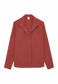 Chemise à carreaux rouge et noire à manches longues avec un grand col à revers. Fabriquée en tissu texturé, avec un devant boutonné.