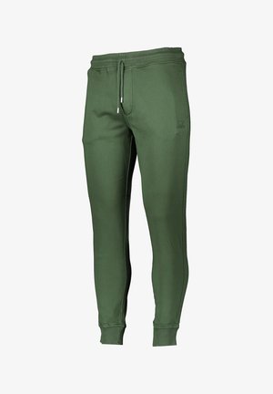 Grüne Baumwollmischung-Jogginghosen mit elastischem Bund und Kordelzug, gerippten Bündchen und Seitennähten. Verfügt über einen dezenten Logo-Akzent auf der Vorderseite.