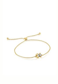 Bracciale in catena d'oro con tre accenti sferici, due in oro e uno con una pietra blu, chiusura regolabile a scorrimento.
