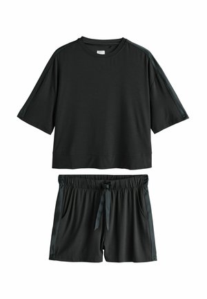 Dark two-piece loungewear set featuring a loose short-sleeve top and relaxed-fit shorts with an elastic waistband and tie in the front.