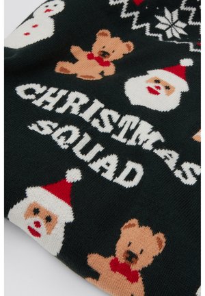 Jersey de punto con fondo verde oscuro y patrones de Papá Noel, muñeco de nieve y oso de peluche. El texto dice "CHRISTMAS SQUAD" en blanco.