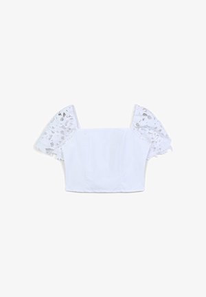 Top bianco corto con scollatura quadrata e maniche a palloncino corte in pizzo con motivi floreali.