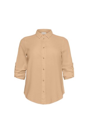 Camicia button-up beige chiaro con colletto, maniche lunghe arrotolate fino ai gomiti e una texture liscia. Presenta un orlo dritto.