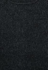 Dark gray ribbed knit pullover with a textured surface and high neckline, featuring a snug fit and subtle variations in color.