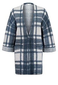 Long gilet à carreaux avec motifs bleus et blancs, col en V, fermeture par un seul bouton, et manches 3/4 retroussées.