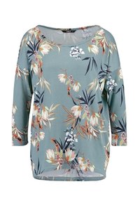 Bluzka z długim rękawem w kwiatowy wzór, wykonana z przygaszonej tkaniny w kolorze morskim. Posiada dekolt w kształcie litery U oraz zaokrąglony dół, charakteryzującą się lekką, miękką teksturą.