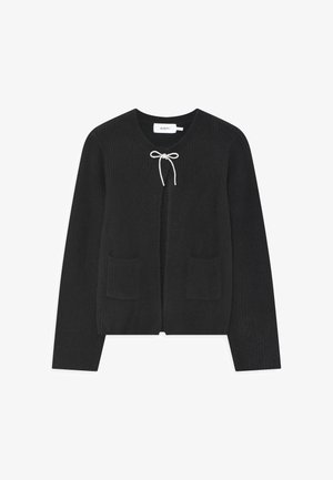 Black ribbed cardigan with a V-neck, front tie closure, and two front pockets. Soft knit fabric with a textured finish.