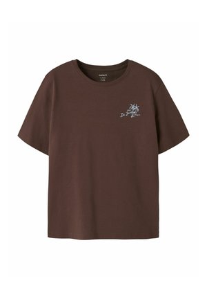 Brown short-sleeve t-shirt with small light blue palm tree graphic and "Hotel De Jardins Antigua" text on left chest.