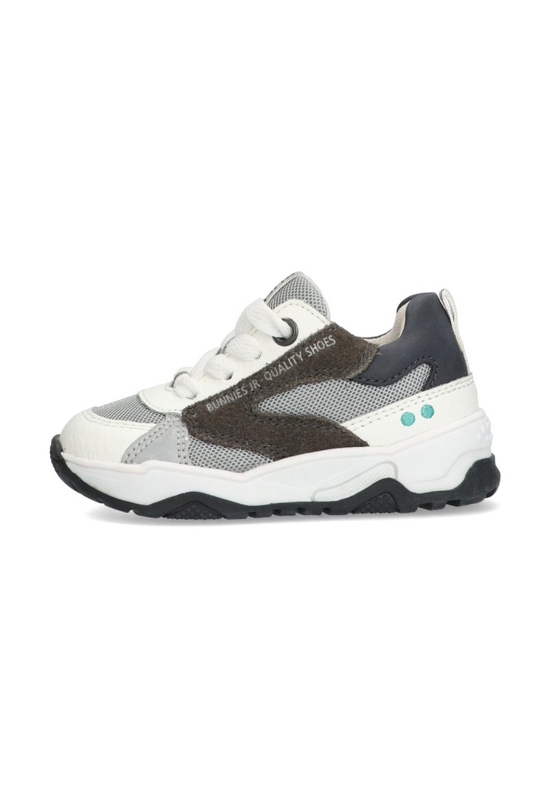 Sneakers featuring a mix of white leather and grey mesh, dark brown suede accents, and a textured black sole. Laced with white laces.