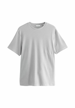 T-shirt gris clair à manches courtes avec une texture côtelée, présentant des rayures horizontales de largeurs variées et un col rond.