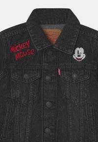 Levi's® MICKEY MOUSE TRUCKER UNISEX - Jeansjacka - washed black
