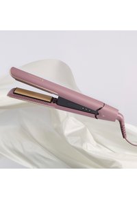 Rosa keramisk hårutglatter med gullplater. Har en svart kontrollpanel og ledning med et sirkulært mønster.