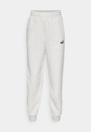 Pantaloni da jogging grigi chiari realizzati in tessuto morbido, con vita elastica, caviglie a costina e un piccolo logo nero sulla coscia sinistra.