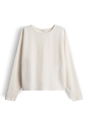 Licht crèmekleurige pullover met lange mouwen, textuurstof met een subtiel patroon, ronde halslijn en een losse pasvorm. Zachte, casual stijl.