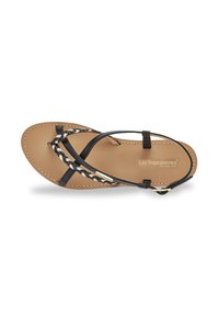 Black leather sandal with braided details and a beige footbed. Features thin straps and a small metallic accent near the ankle.