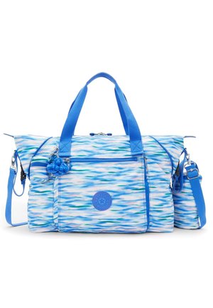 Blue patterned duffle bag with a textured finish, featuring dual top handles, adjustable shoulder strap, front zip pocket, and charm accent.