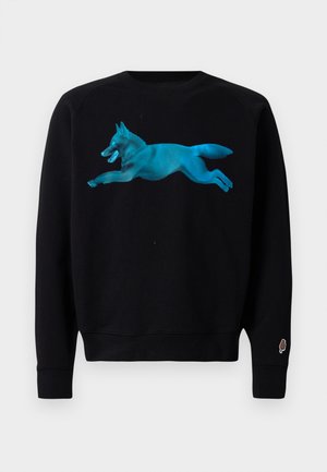 Sweatshirt noir avec un graphique turquoise d'un renard sautant. Possède des poignets et un ourlet côtelés, ainsi qu'un petit logo de cornet de glace sur la manche.