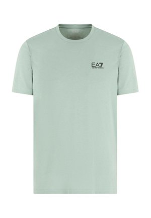 T-shirt a maniche corte verde menta in cotone con scollatura rotonda. Presenta un piccolo logo EA7 nero sul petto. Design semplice.