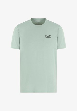 T-shirt a maniche corte verde menta in cotone con scollatura rotonda. Presenta un piccolo logo EA7 nero sul petto. Design semplice.