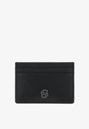 Porte-cartes en cuir noir doté de quatre fentes pour cartes, logo embossé sur le devant, et texture lisse avec des détails de couture précis.