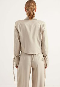 Chiquelle Tygbyxor - beige