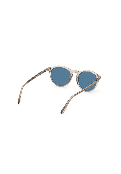 Runde Sonnenbrillen mit blauen Gläsern, klarem Rahmen und schlanken silbernen Bügeln. Minimalistisches Design, das Licht reflektiert und die Gläser hervorhebt.
