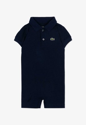 Tutina corta a maniche corte di colore blu navy per bambino, con colletto, due bottoni frontali e un piccolo logo di coccodrillo verde sul petto.