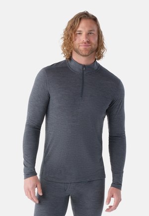 Men's long-sleeve, dark gray shirt with a half-zip collar. Features a smooth texture and fitted design, paired with matching gray bottoms.