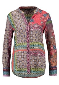 Multicolored long-sleeve shirt with various geometric and floral patterns. Features a collared neckline and button front closure.