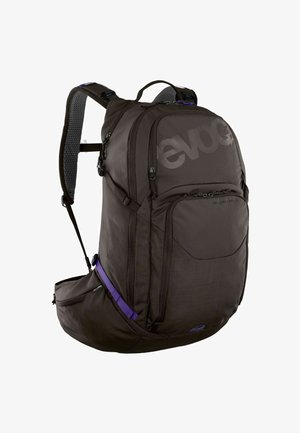 Schwarzer Rucksack mit lila Akzenten, verfügt über ein großes Hauptfach, mehrere Reißverschlusstaschen, gepolsterte Träger und atmungsaktives Mesh-Detail.