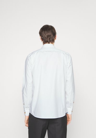 White long-sleeve shirt with a classic collar, button cuffs, and a curved hem, made from smooth, lightweight fabric.