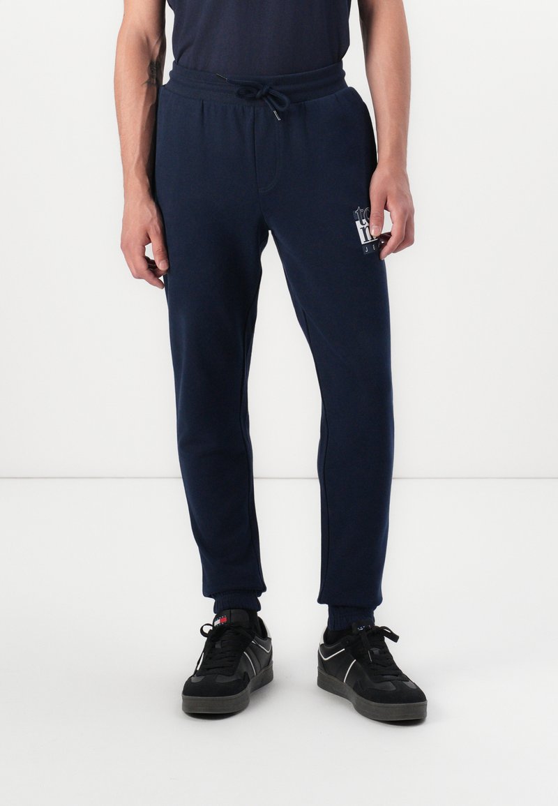 Tommy Jeans SLIM FLAG - Trainingsbroek - dark night navy