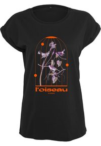 Black T-shirt with rolled sleeves featuring an orange graphic of a birdcage, flowers, and text "l'oiseau de paradis" in bold font.