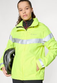 Lightweight, neon yellow rain jacket with reflective silver stripes, front zipper, adjustable cuffs, and pockets. A cyclist's helmet held in one hand.