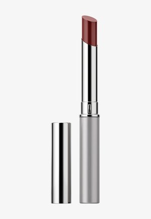 Lipstick in a silver cylindrical tube, with a glossy silver cap. Color is a deep red, with a semi-matte finish and rounded tip.