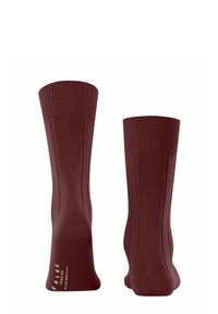 Burgunderfarbene Baumwollsocken mit geripptem Design und verstärkten Bündchen. Sie zeichnen sich durch eine glatte Textur und ein dezentes Markenlogo nahe dem Knöchel aus.
