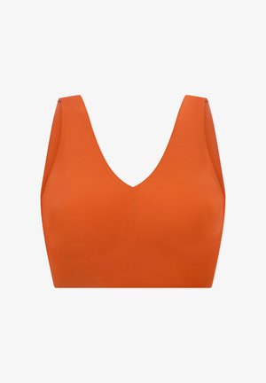 Brassière de sport orange vif sans coutures avec larges bretelles et encolure profonde en V, conçue pour le confort et le maintien.