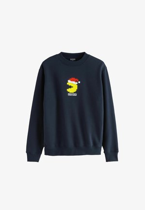 Marineblauwe sweatshirt met geribbelde ronde hals. Aan de voorkant staat een pixelartontwerp van een gele karakter met een rode kerstmanmuts.