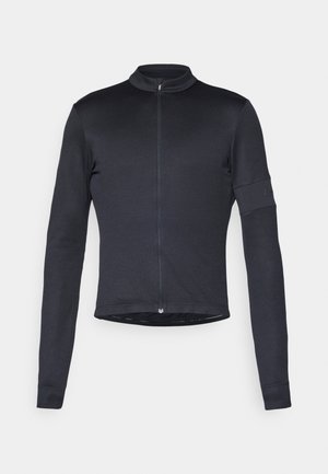 Long-sleeve, black cycling jersey made of smooth, stretch fabric with a zip front, high collar, and arm pocket detail.