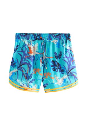 Blå tropiske badebukser med et livligt blomsterprint, elastisk taljebånd og kontrasterende gule striber ved kanten.