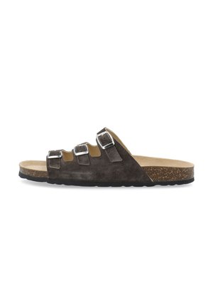 Brown suede slide sandal with three adjustable silver buckles, cork footbed, and textured black rubber outsole. Flat design for easy wear.
